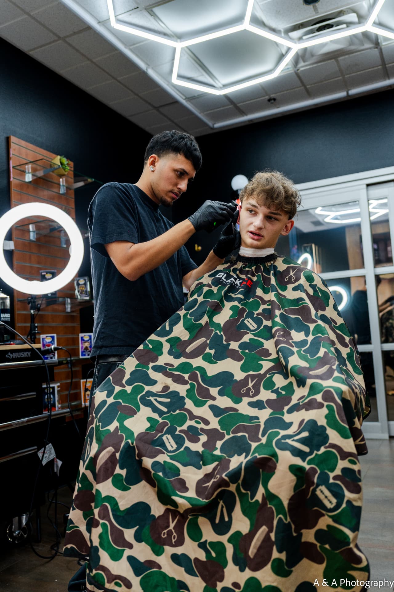 Eli cutting hair at E's Blendz Barbershop in West Little Rock
